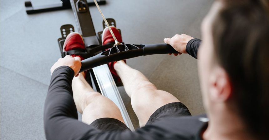 back rear view man exercising using row machine gym 1200x628 facebook
