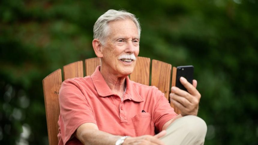 elder male talking on phone