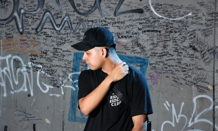 Contemplative Rider Against Graffiti Wall 1000x600
